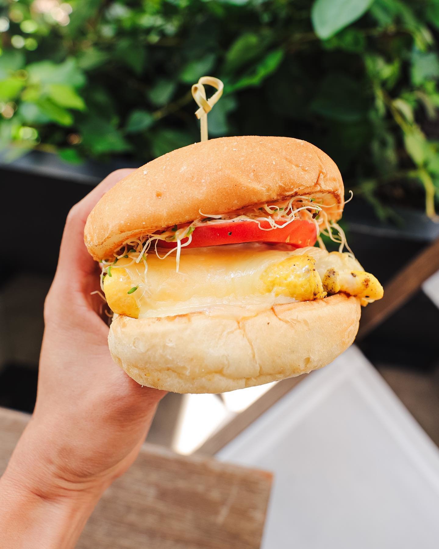breakfast sandwich with egg and tomato